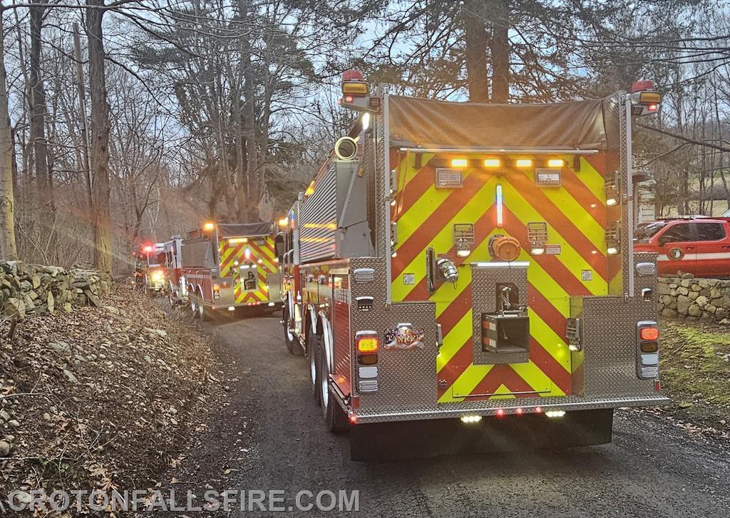 CFFD units on the road in front of the fire scene.